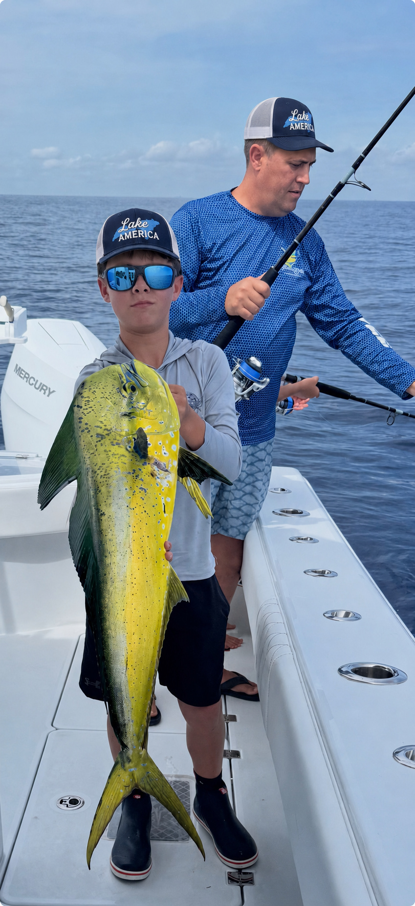 Anglers wearing Lake America hats while fishing offshore
